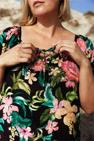 blonde plus size women at the beach wearing floral mesh tie up beach cover up