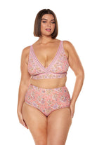 Brunette model wears flattering high waisted bikini bottoms in delicate floral print