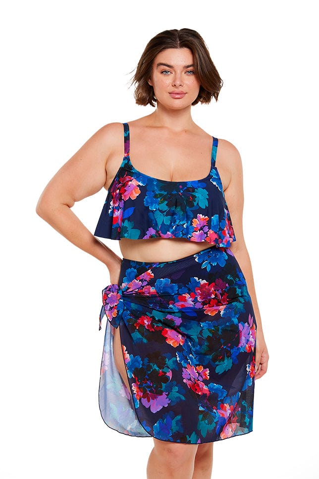 Brunette plus size model wears navy and red floral mesh tie up sarong