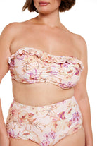 Brunette model wears flattering underwire bandeau bikini top with frill detail and removable straps