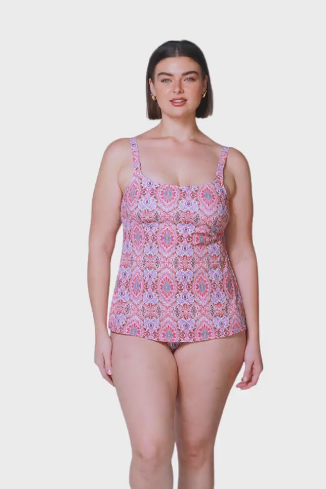 product video of brown haired women wearing flattering pink tankini top with a scooped neckline and adjustable straps