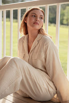 Model wearing cream Long Button Up Pyjamas
