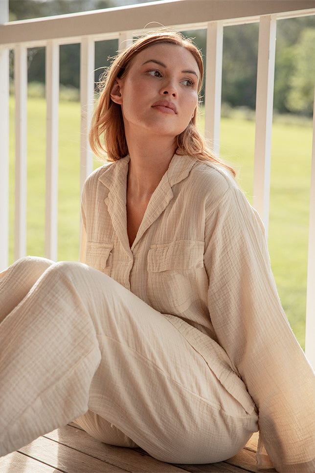 Model wearing cream Long Button Up Pyjamas