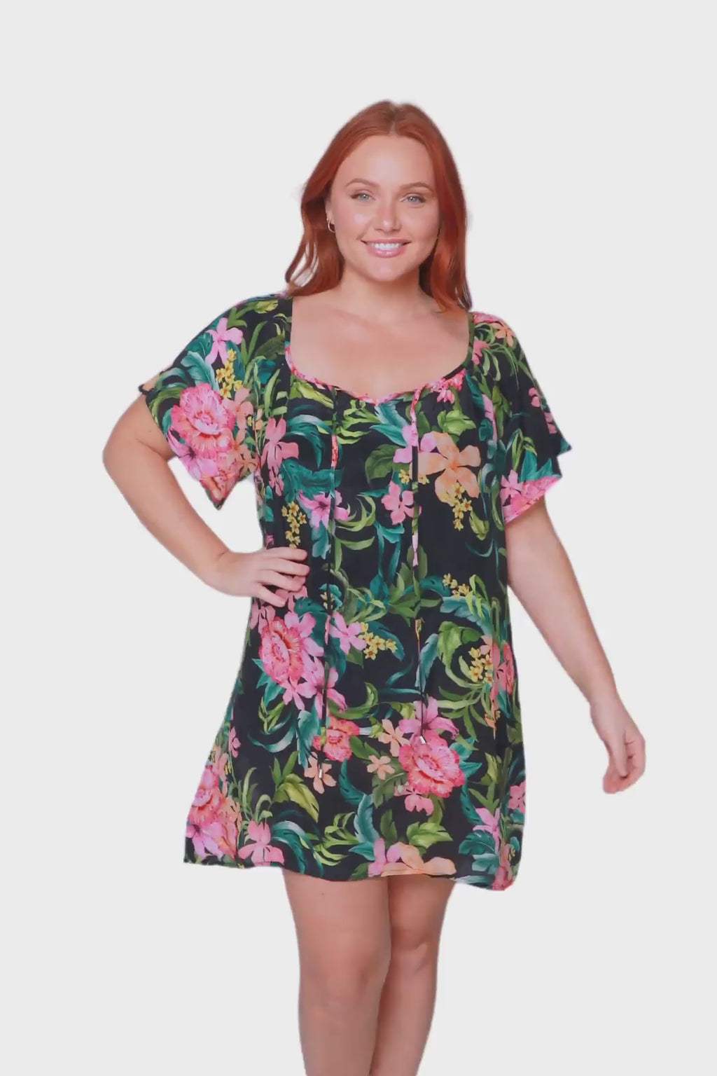 Plus size red head model wears floral green mesh beach cover up