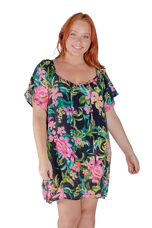 redhead model wears lightweight mesh beach cover up in tropical print