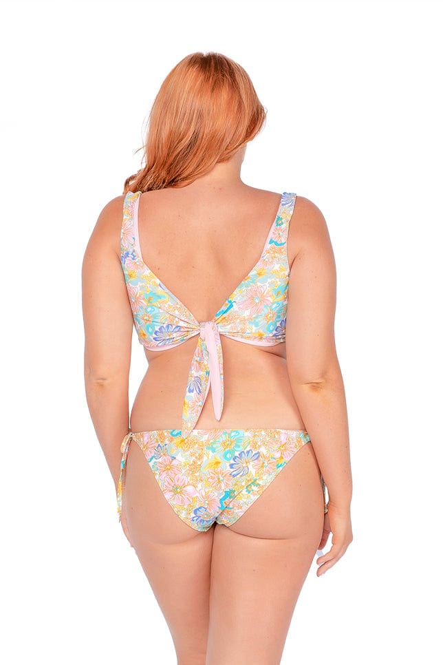 gold coast model wearing low rise retro floral swim pant with adjustable side ties
