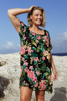 plus size blonde model wears mesh over shirt cover up at the beach